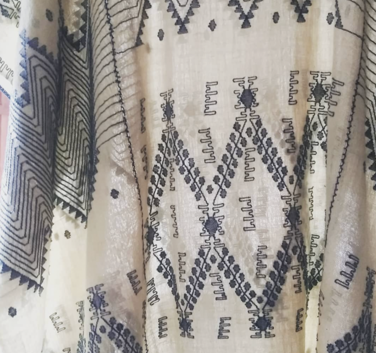 A handmade garment hangs on display at the natural Indigo dye shop in Antigua, Guatemala.