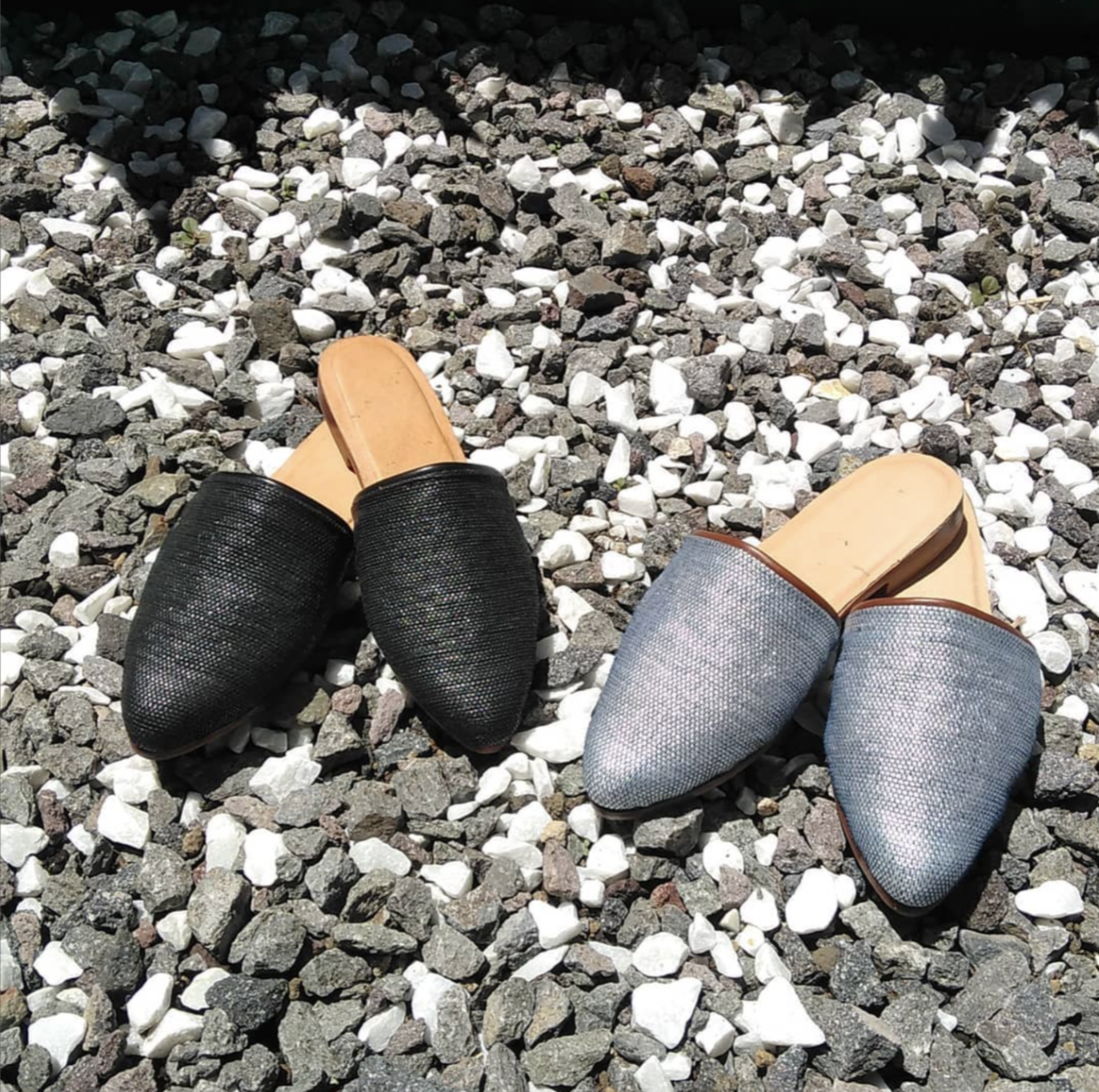 Two pairs of shoes are on display from the Indigo shop in Guatemala.