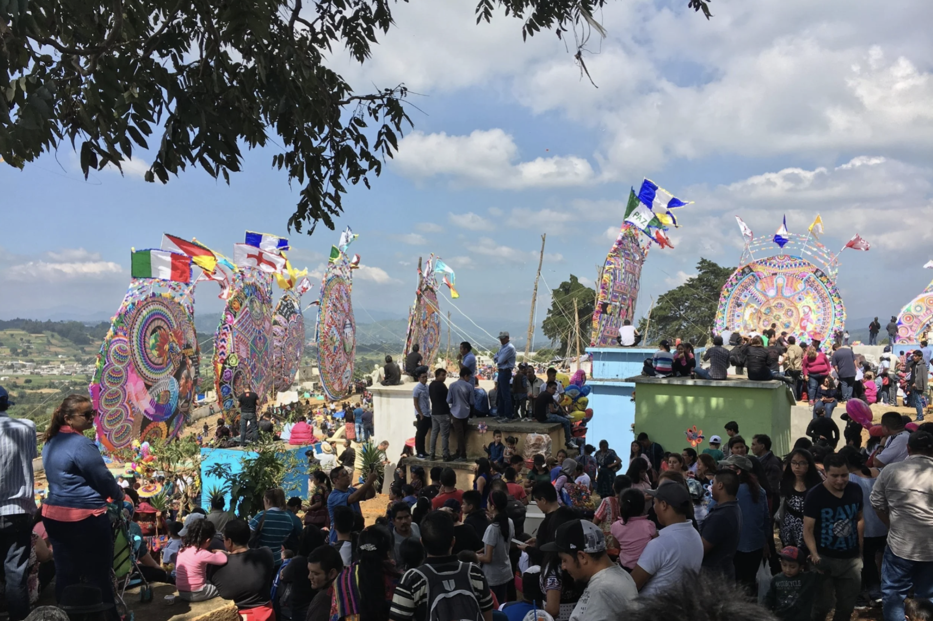 People are gathered in the cemetery on the hillside of Sumpango for the annual Kite Festival on November 1st.
