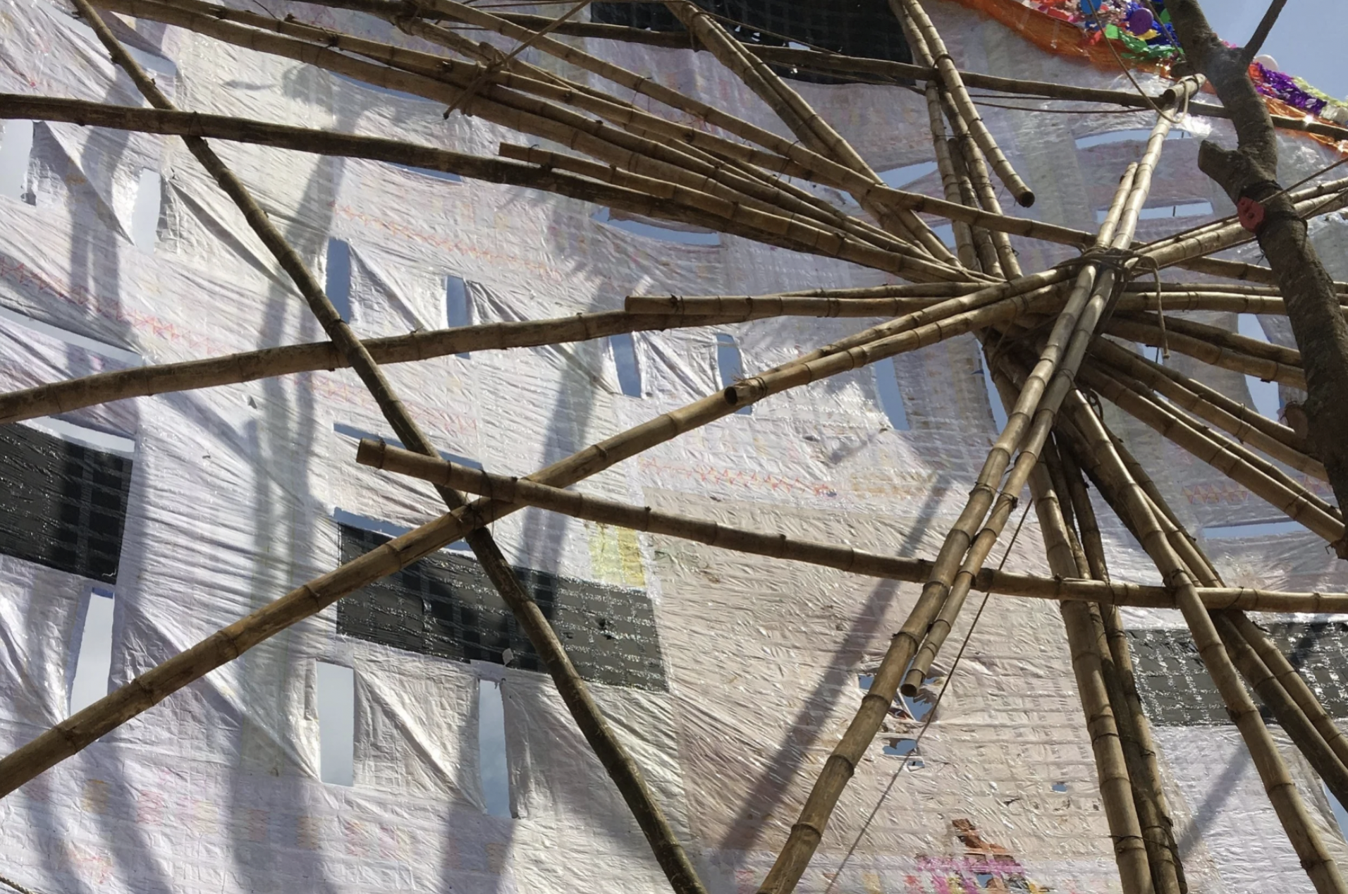 A photo of the backside of the large handmade kites that are constructed with bamboo, glue, and string for the annual kite festival