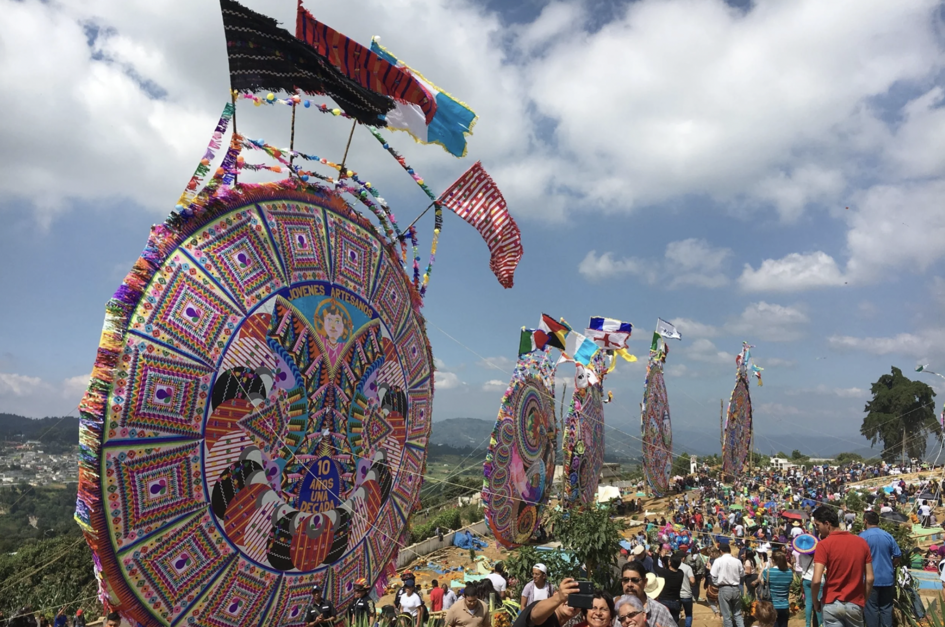 Crowds are gathered on the hilltop of Sumpango for the annual Kite Festival on November 1st for their Day of the Dead celebration.