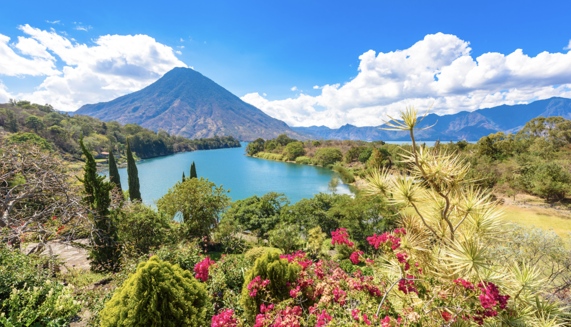 A beautiful picture of a lake and the surrounding volcanoes in the Guatemalan Highlands
