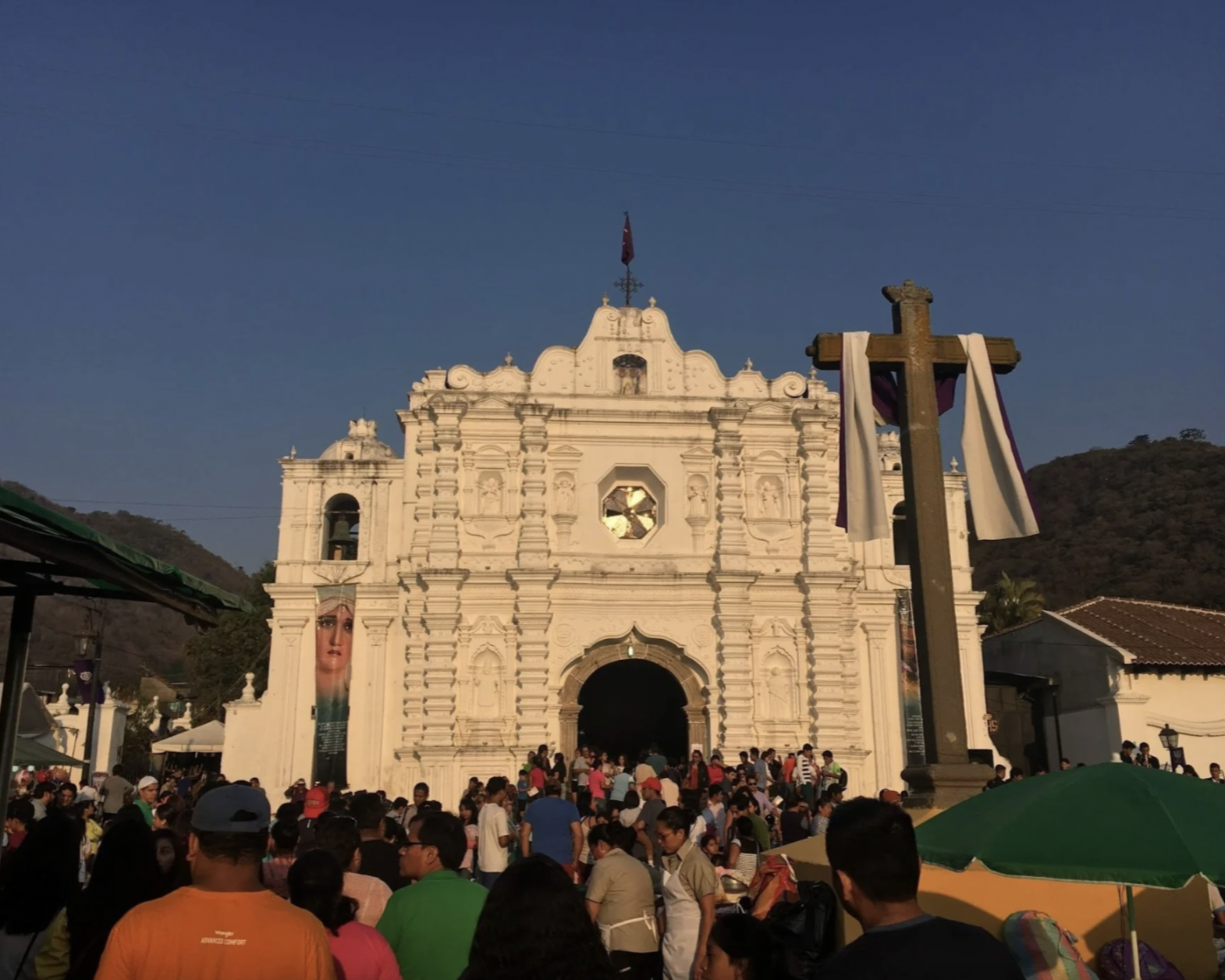 Crowds are gathered outside a church during Semana Santa in Guatemala