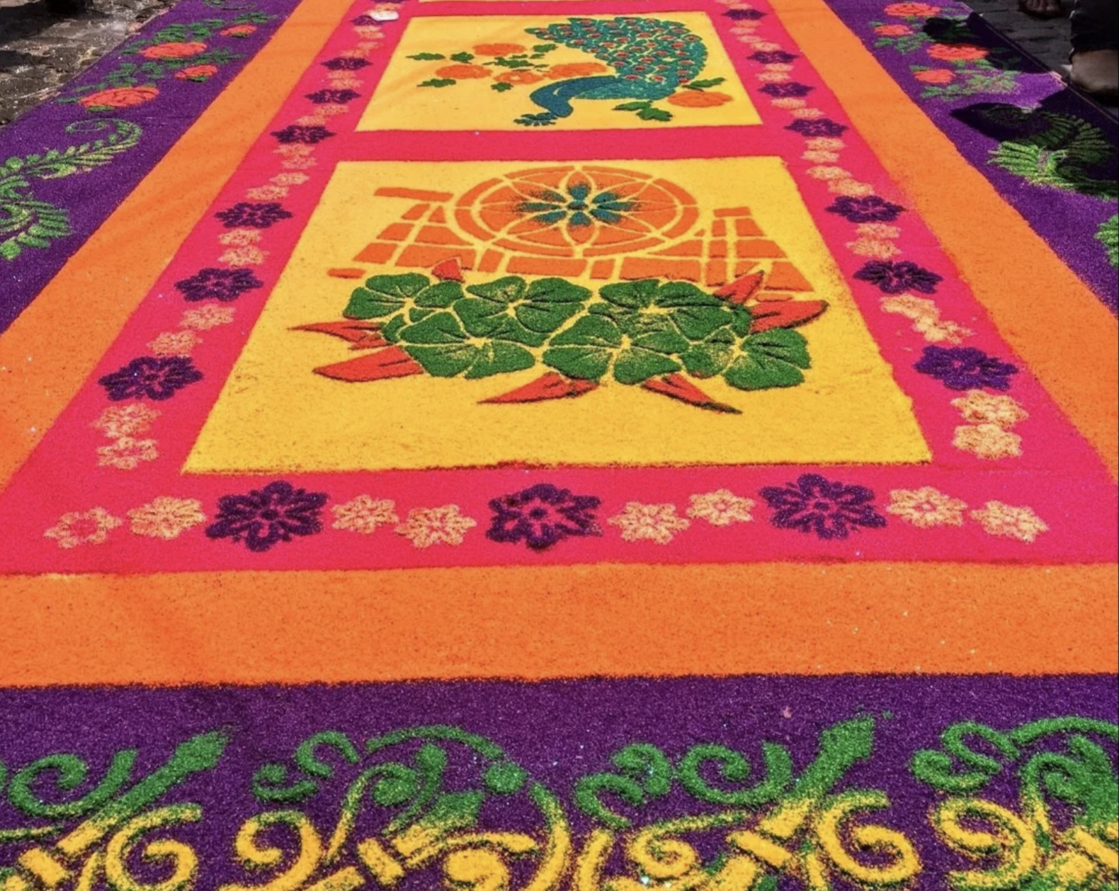 A colorful carpet on the street for Semana Santa in Guatemala