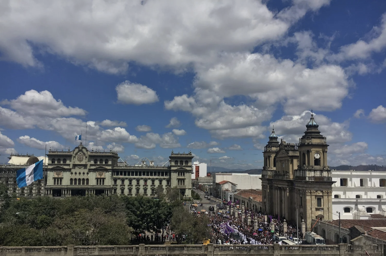 Guatemala City during the day with people gathered in the streets
