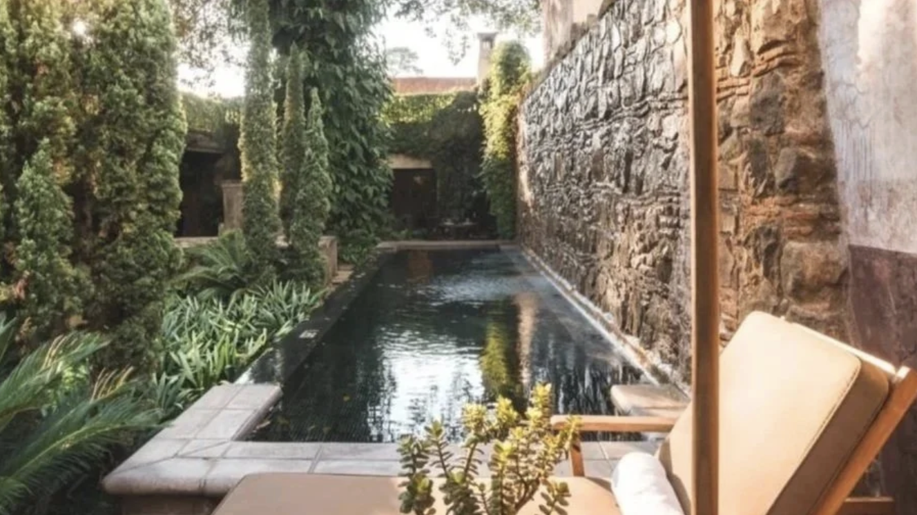 An outdoor pool and courtyard at the El Convento Boutique Hotel in Antigua