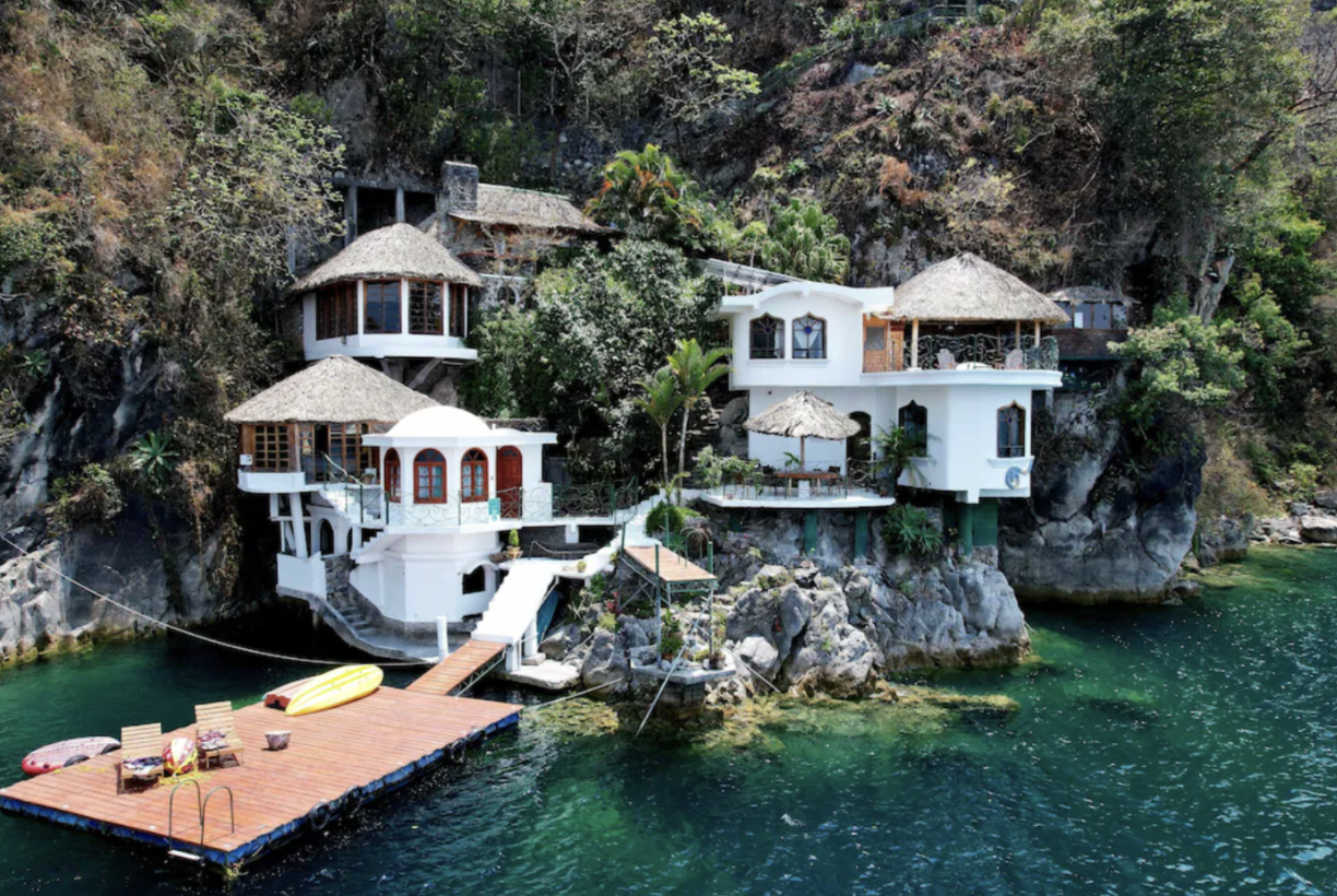 The Kaalpul Atitlan Eco Hotel and Spa has buildings built into the mountain on the water in Lake Atitlan