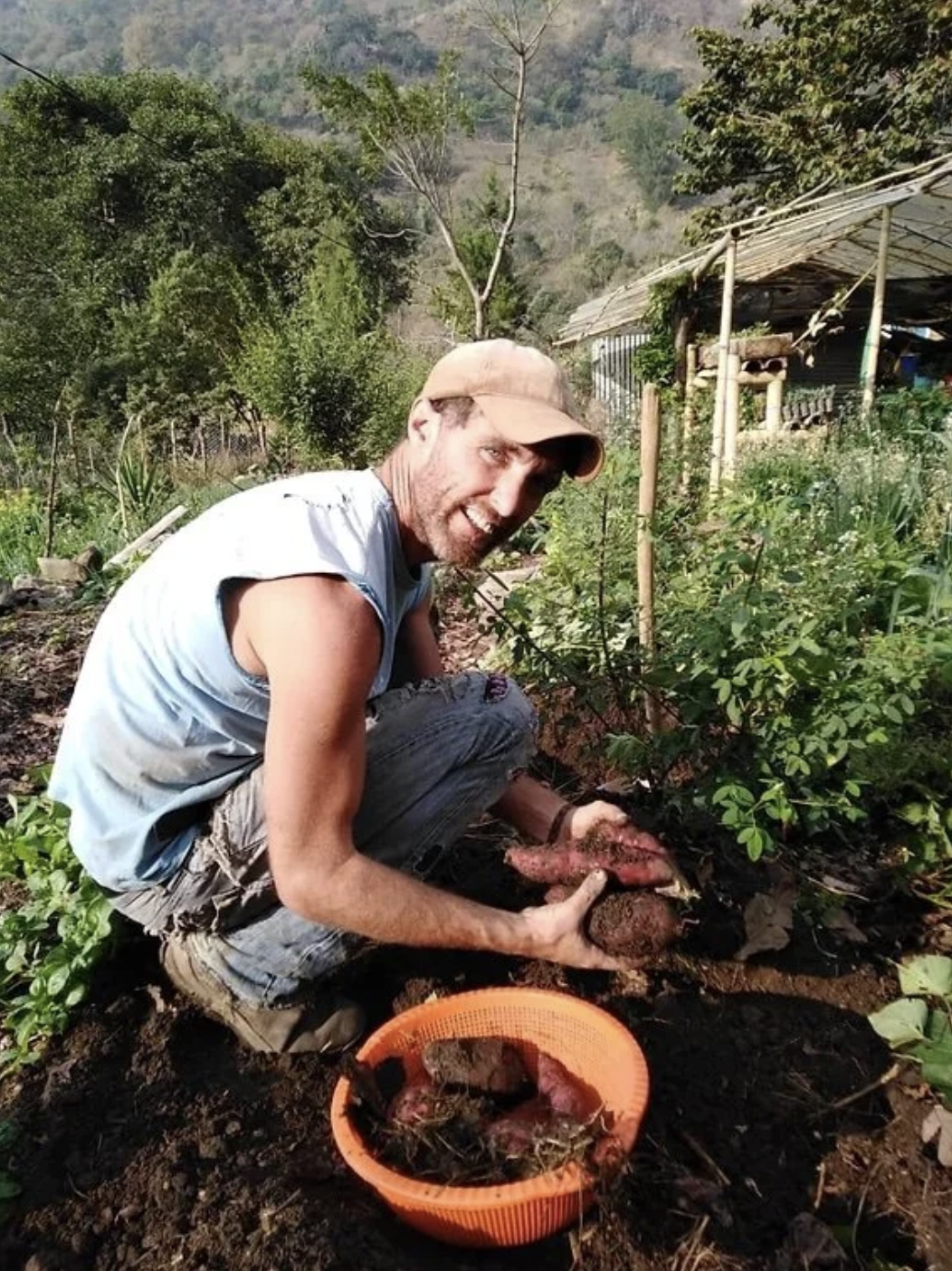 A man is working on a permaculture farm in Guatemala