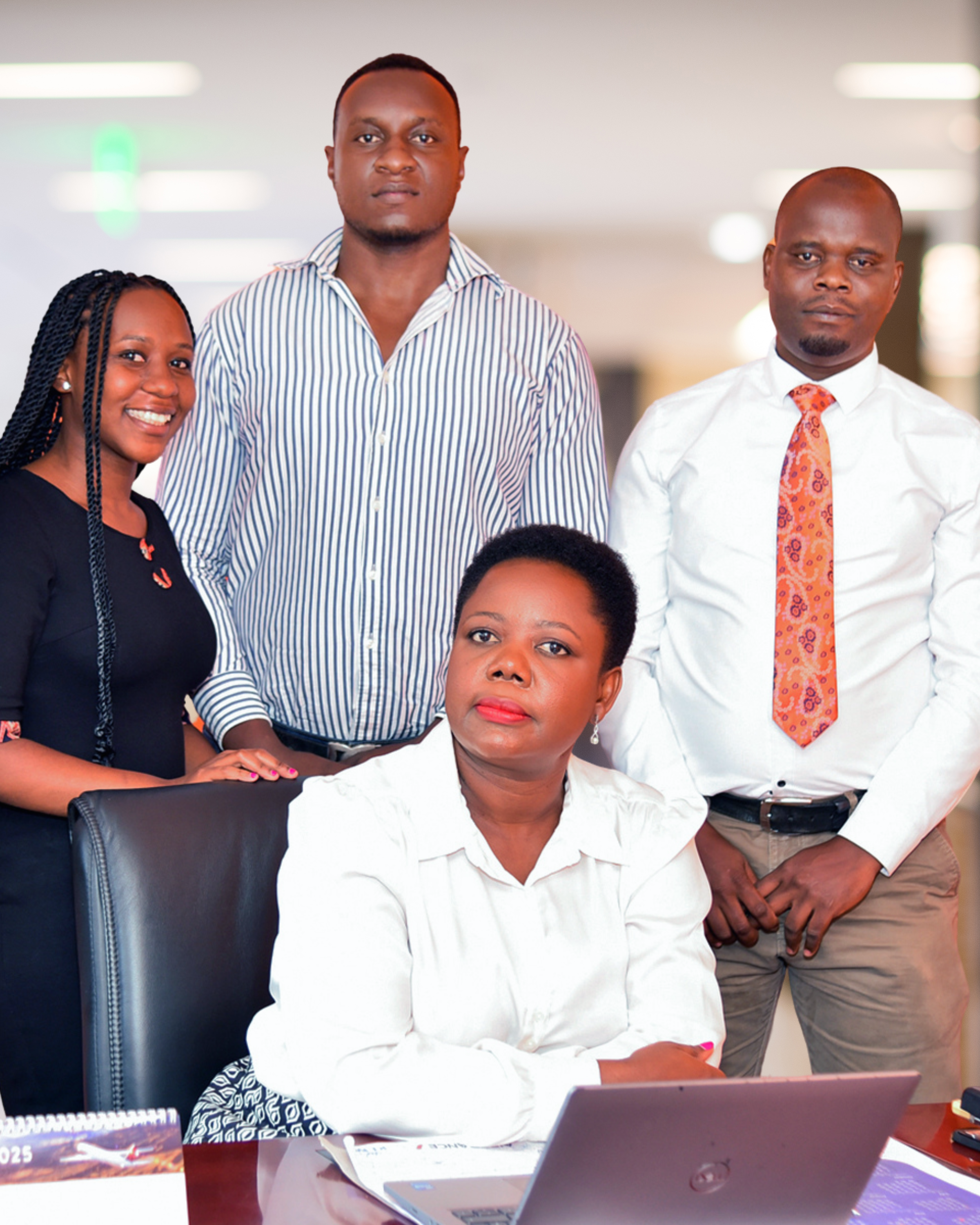 Founder Evelyn Sylvia Nakazi with the Iconic Travel Services team at their Kampala office