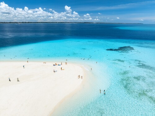 White sandbank and turquoise water off the coast of Zanzibar