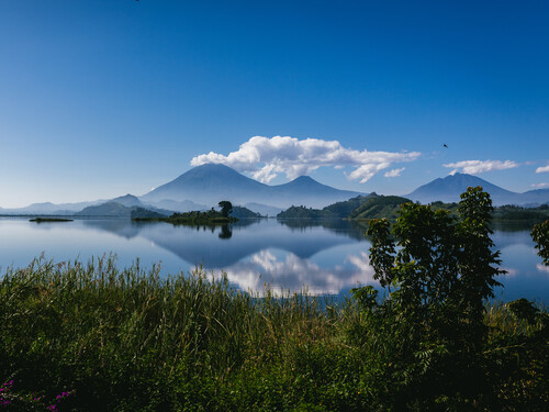 Lake Mutanda with the Virunga volcanoes on the horizon