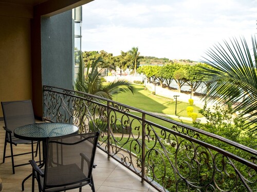 View from a balcony over gardens at Protea Hotel Entebbe
