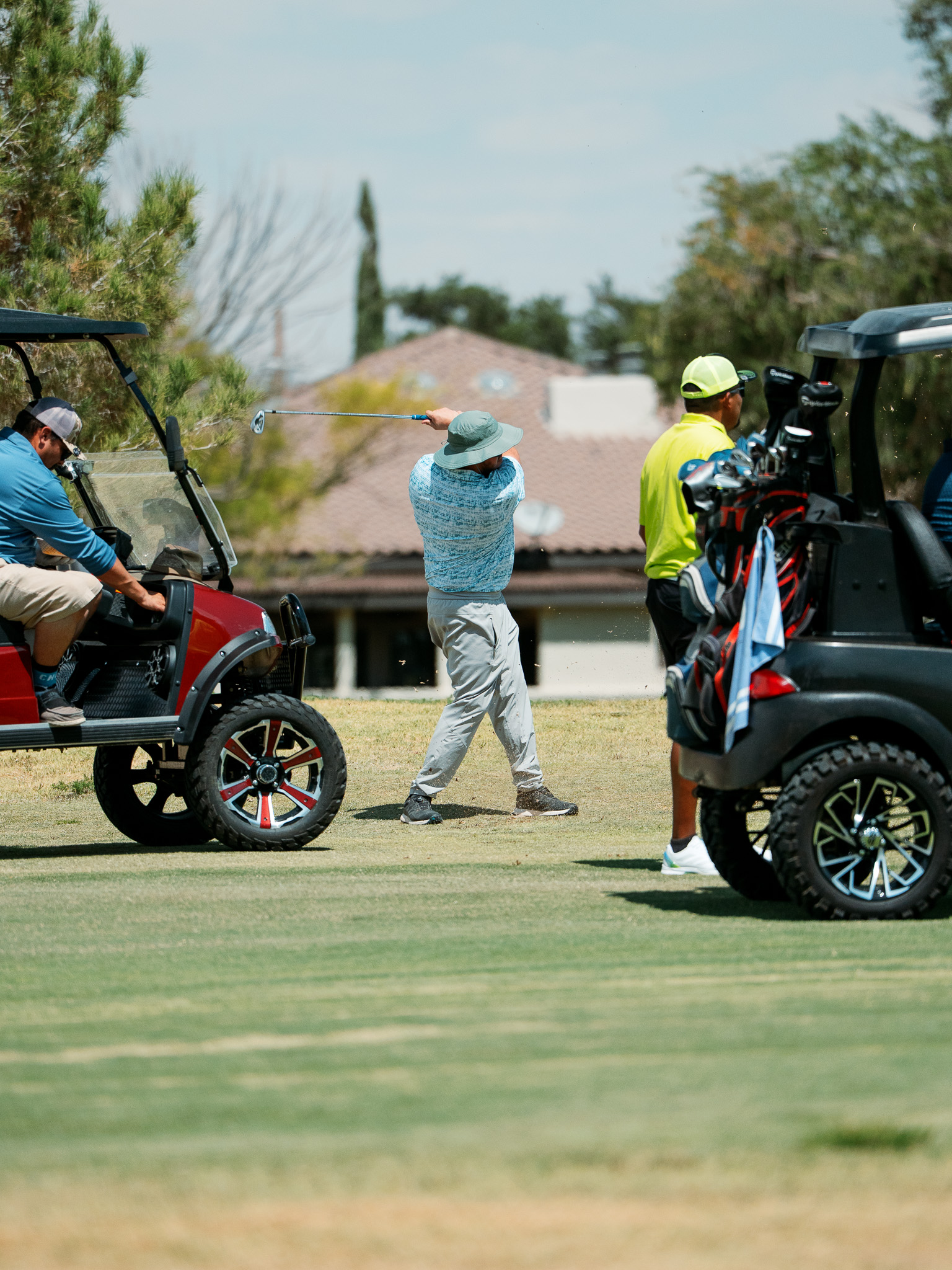 Golfers driving off the tee at Riverside