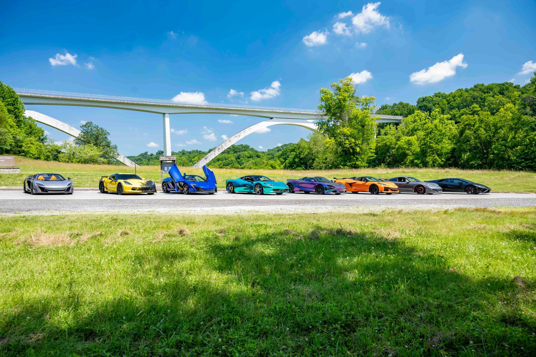 Exotic cars lined up at a Regulators Car Club bridge photoshoot near Nashville