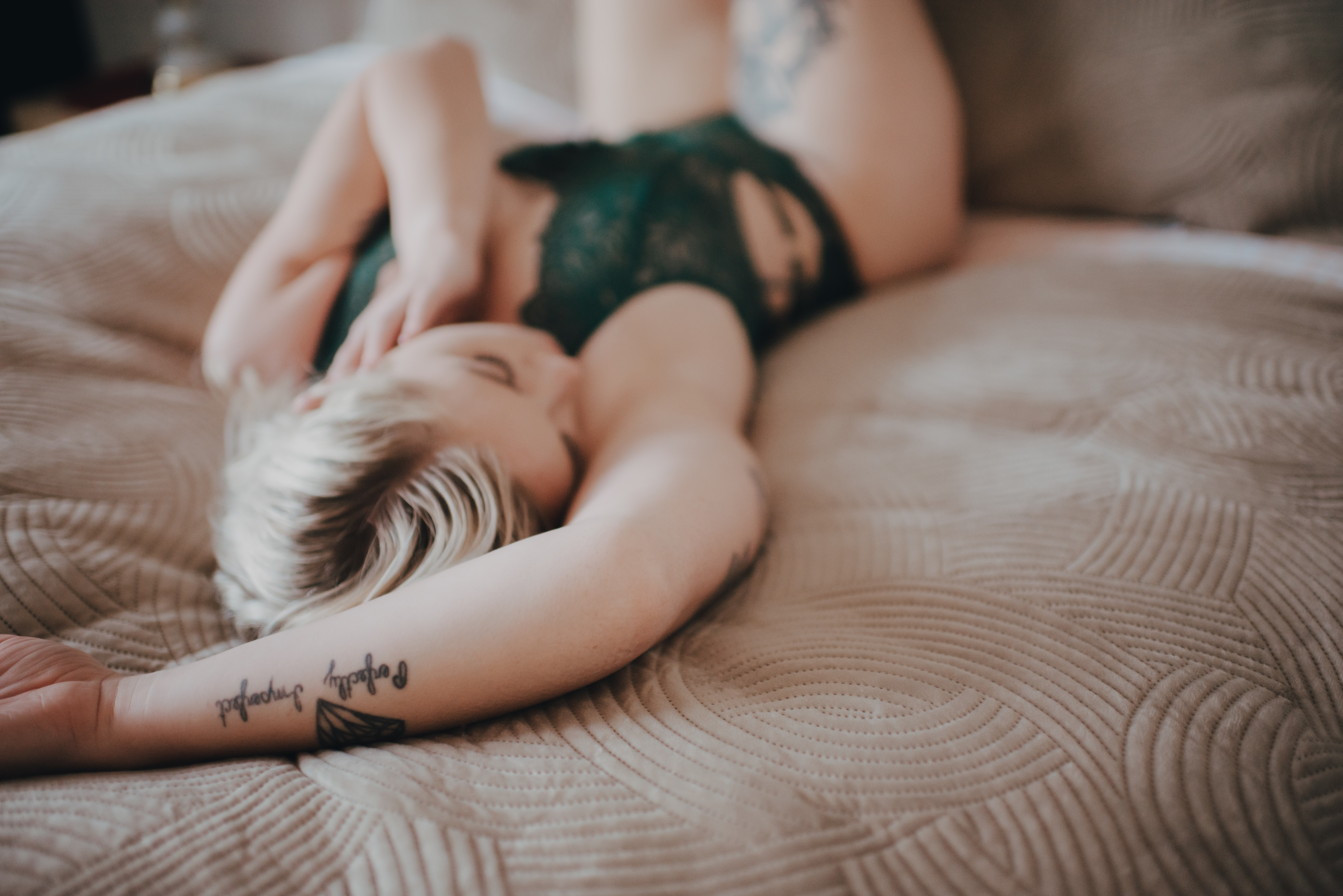 woman lying on a bed woman lying on a bed