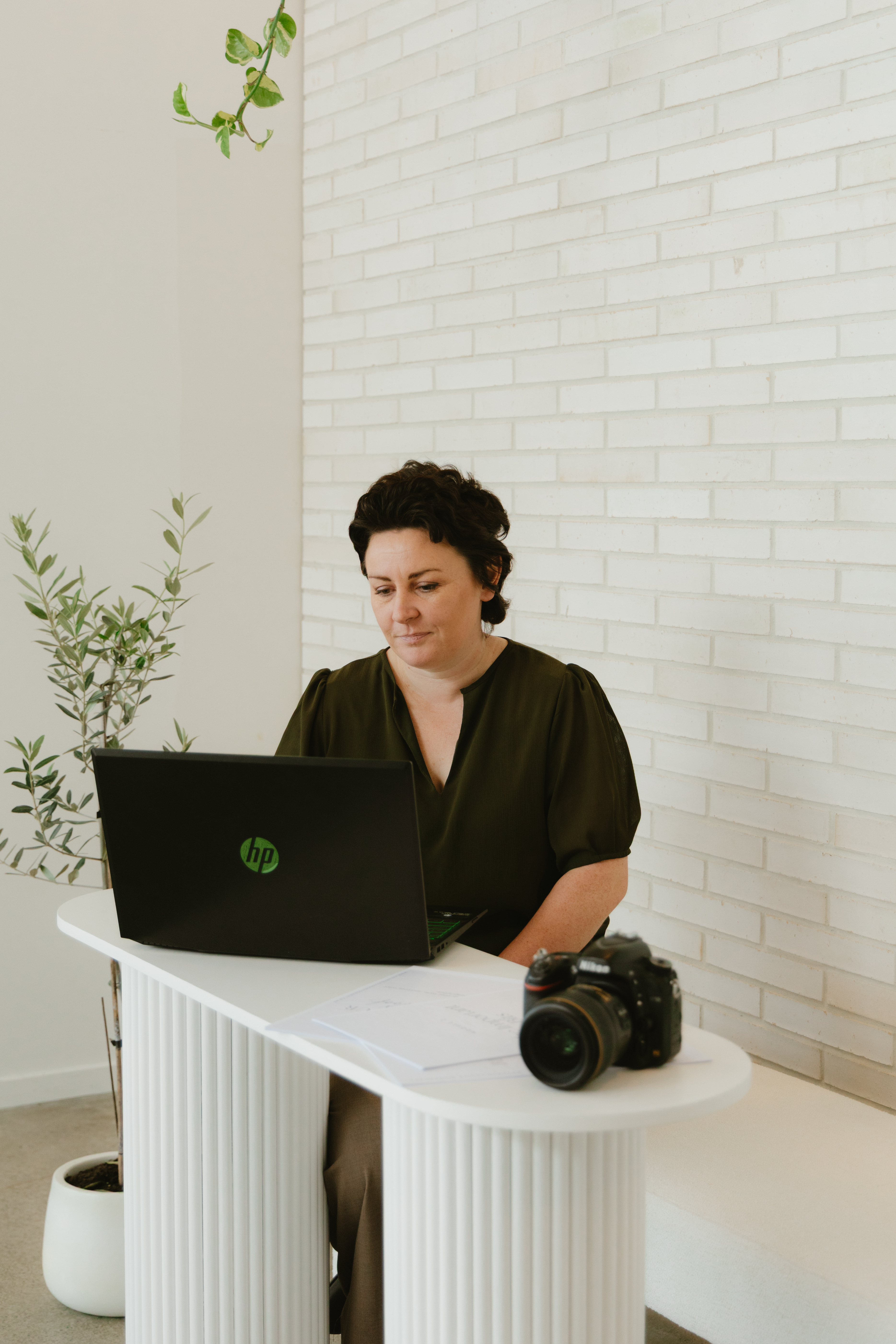 portrait of a photographer at a laptop