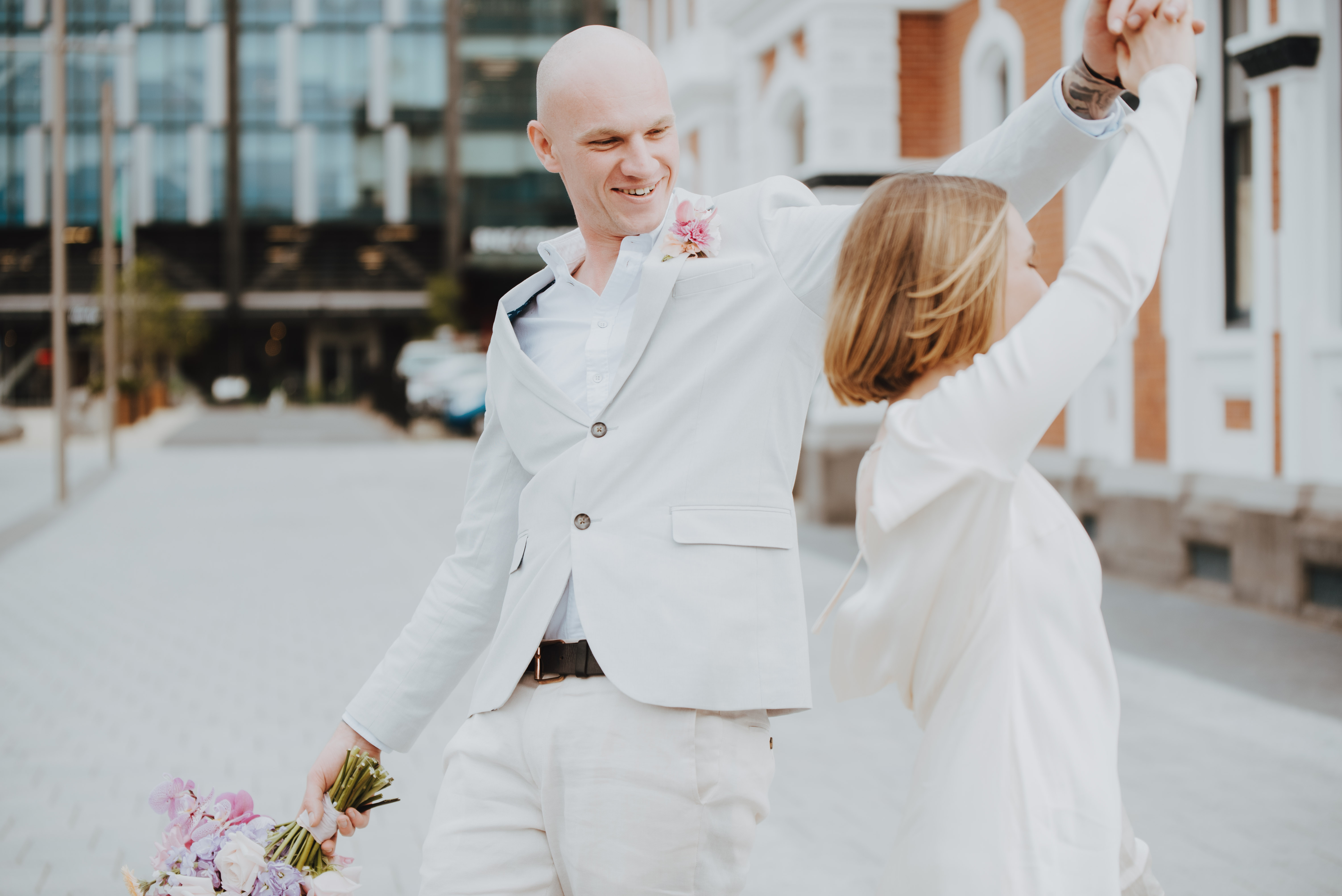 newlyweds dancing in cathedral square
