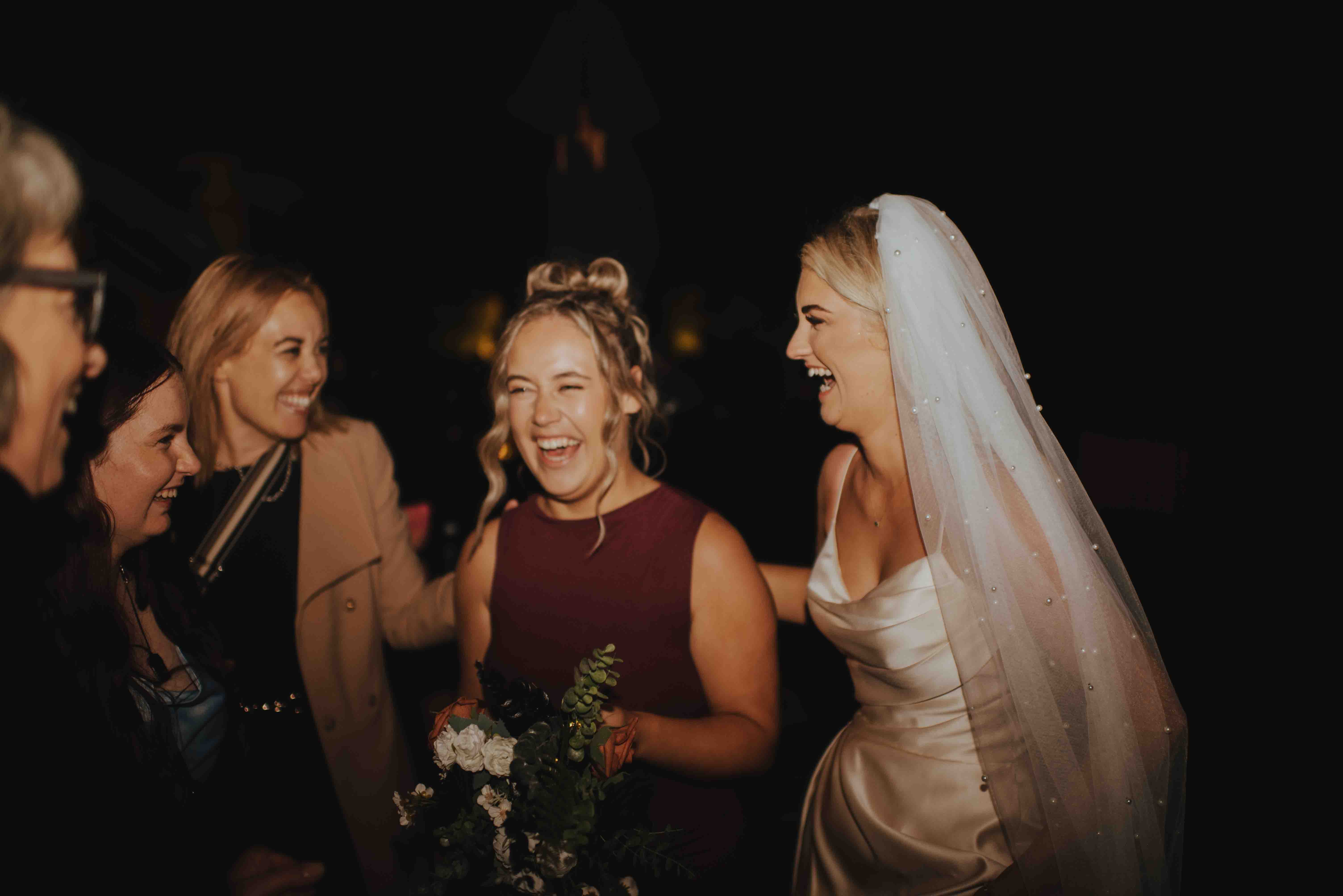 guests and bride laughing guests and bride laughing