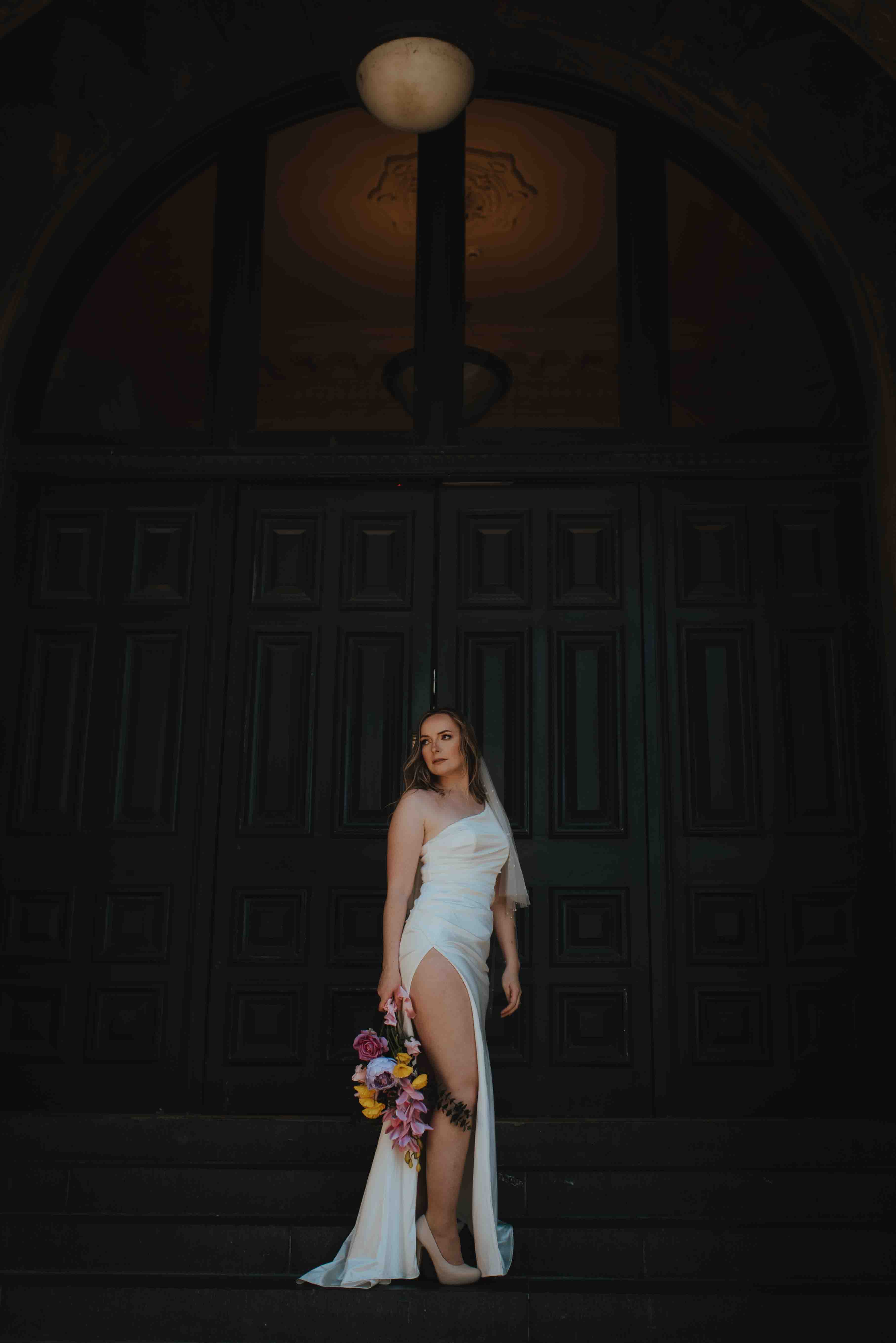 the dark doors at the side of O.G.B for wedding portraits