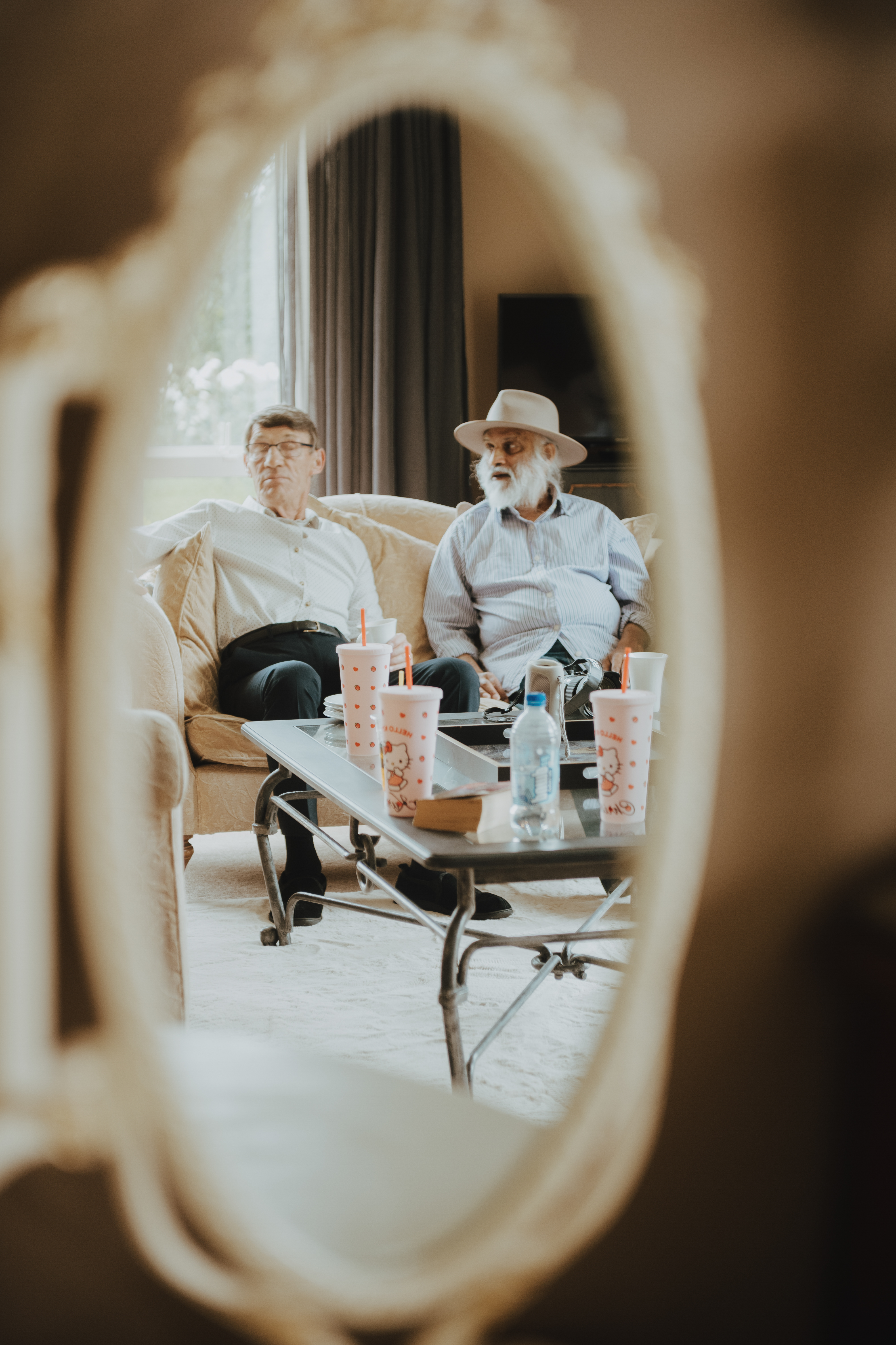 brides father and uncle lounging on the sofa relaxing brides father and uncle lounging on the sofa relaxing