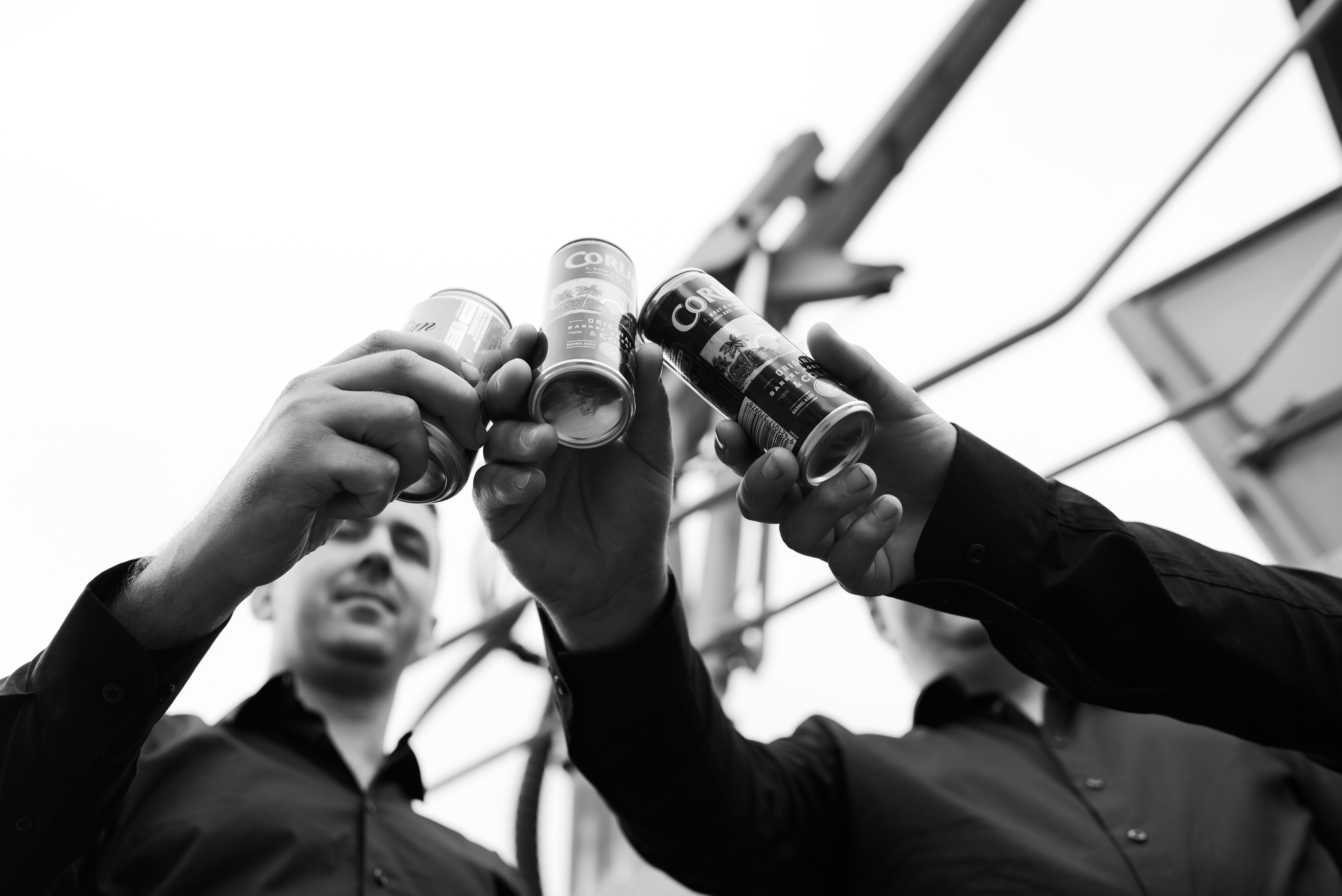 groomsmen having a cheers moment before the wedding