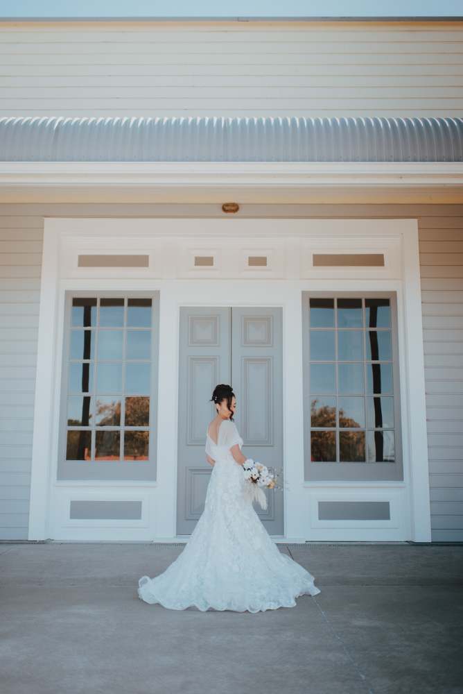 bride in front of historic christchurch doors bride in front of historic christchurch doors