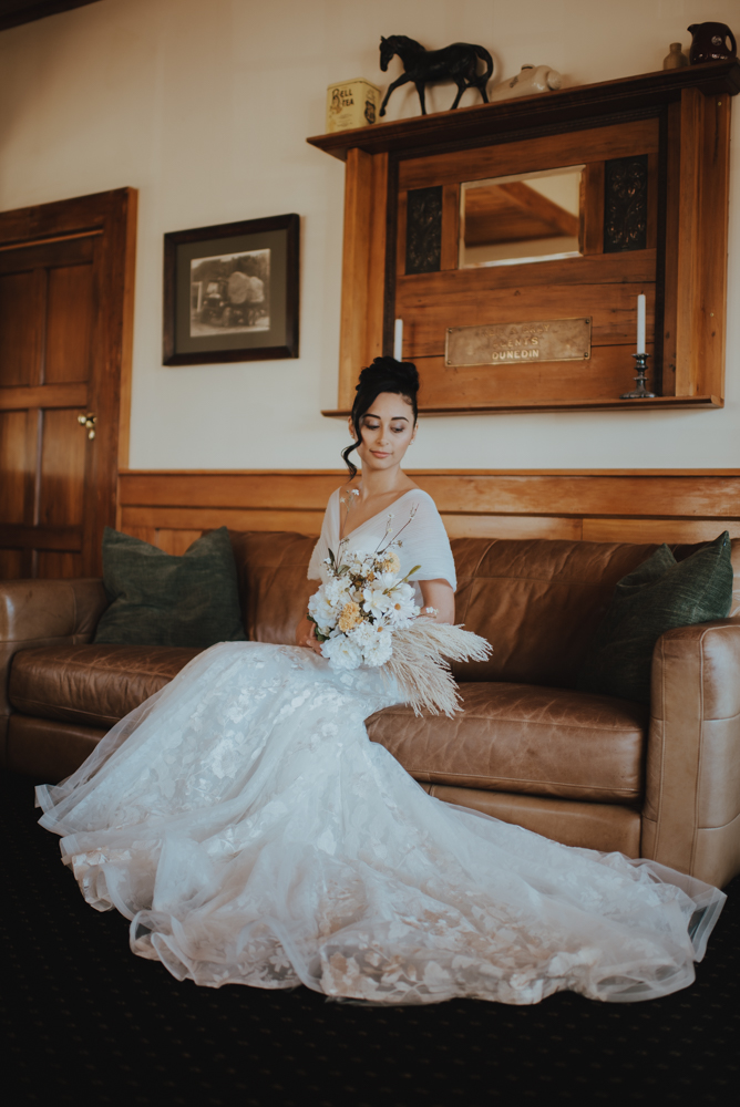 bride lounging on a chair before the ceremony bride lounging on a chair before the ceremony