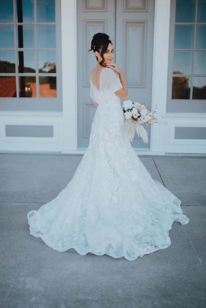 bridal gown on display in front of historic doors bridal gown on display in front of historic doors