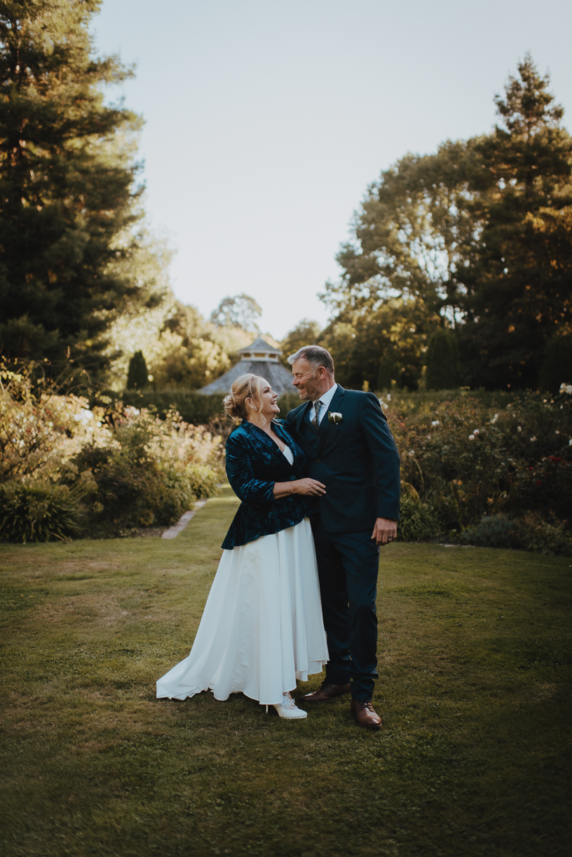 couple smiling and laughing during their wedding photos