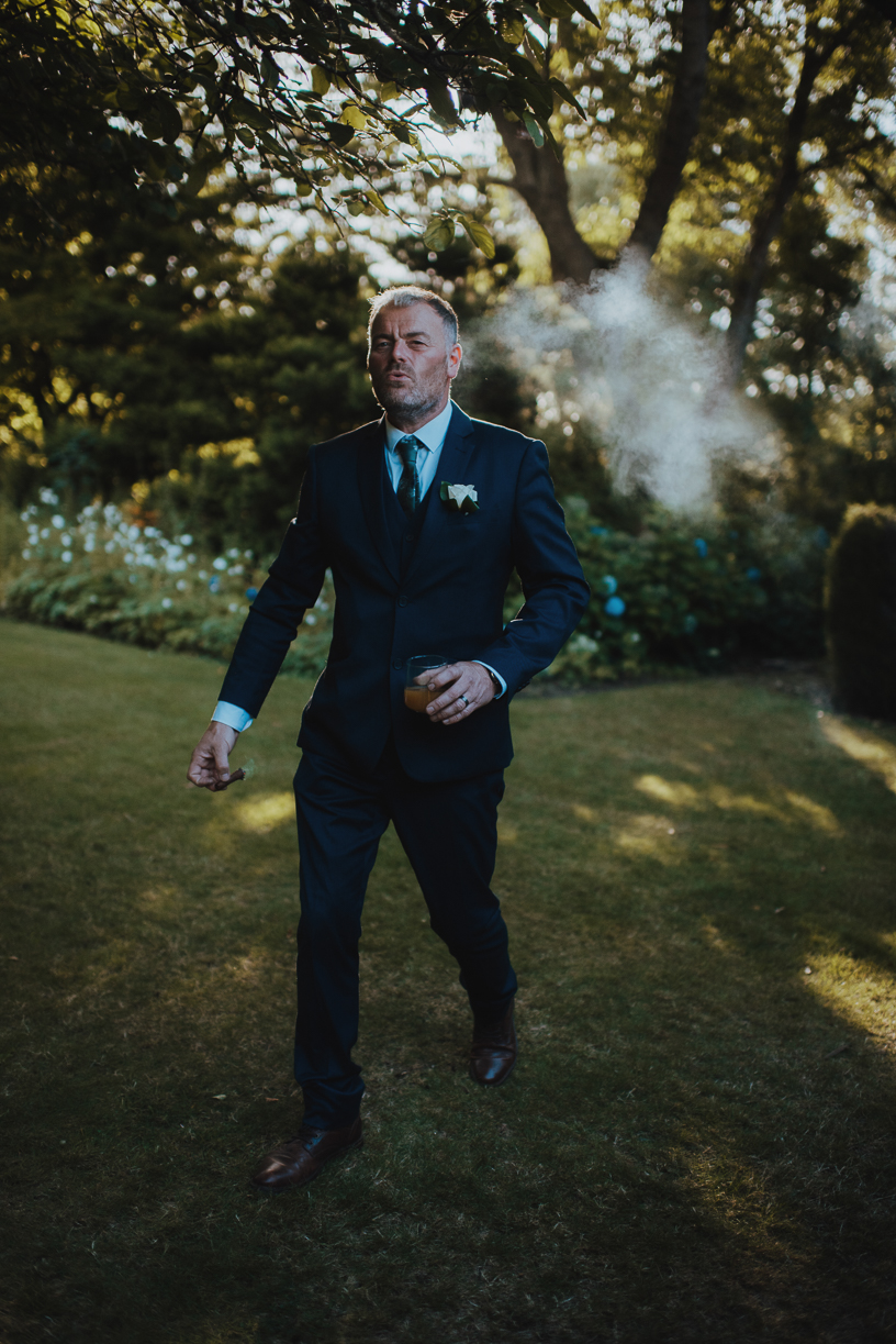 colour version of a groom smoking a cigar colour version of a groom smoking a cigar