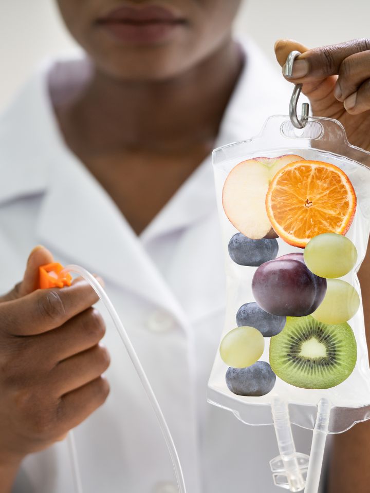 Close-up of IV drip filled with fruits, symbolizing nutrient-rich vitamin infusion for hydration, energy, and wellness therapy.