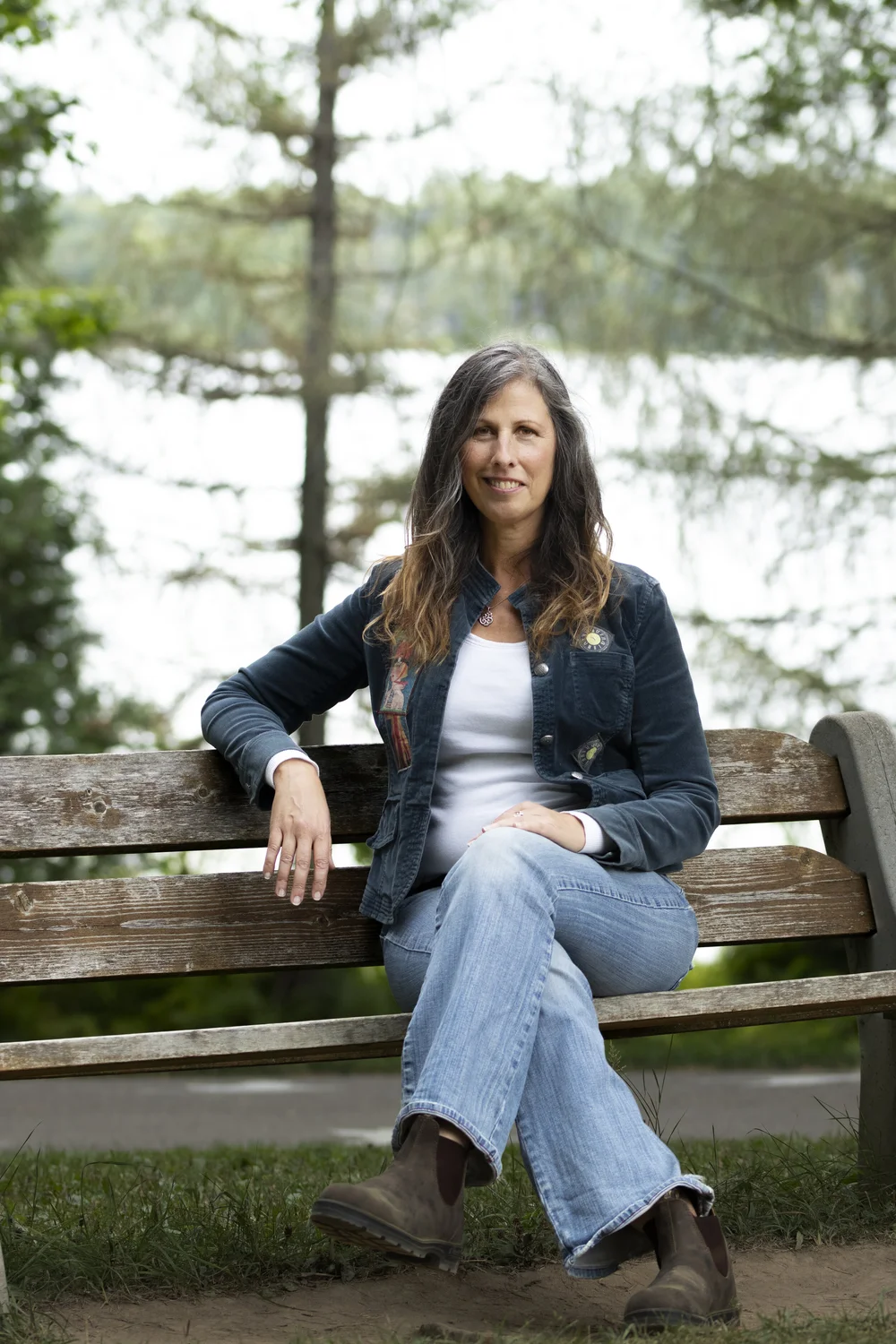 Jasmine I., sitting on a bench by the water