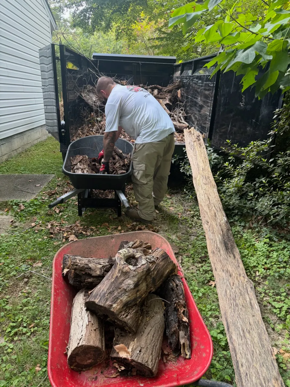 Dumpin' Loads owner working on a debris removal job