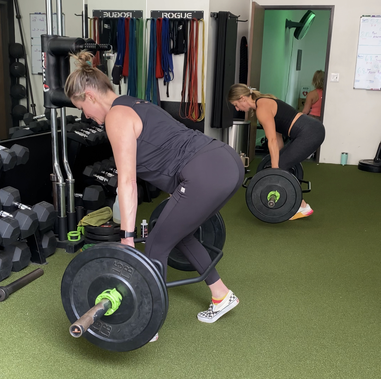 fit orange county women lifting weights