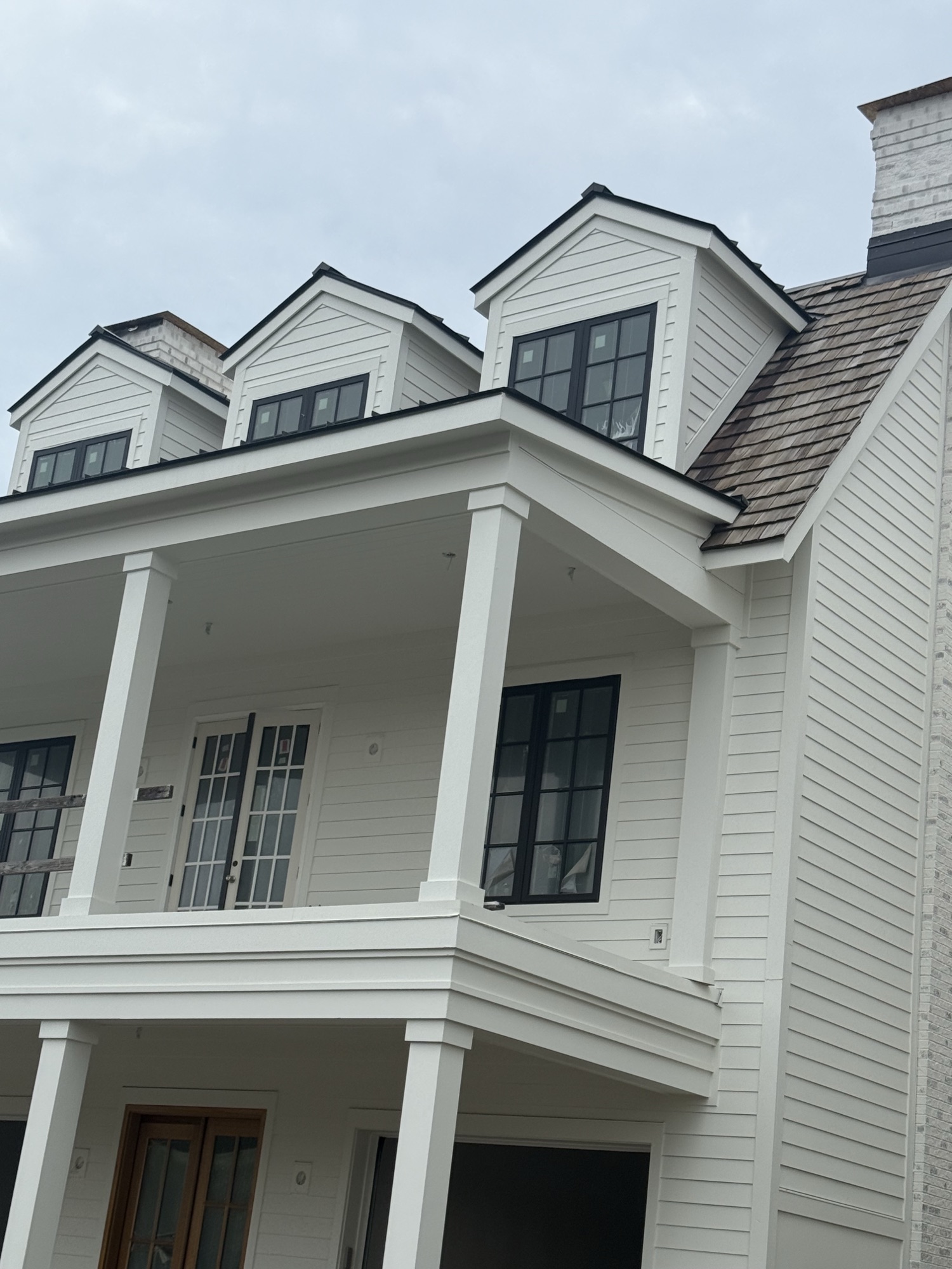 Natural cedar shake roof on a coastal custom home