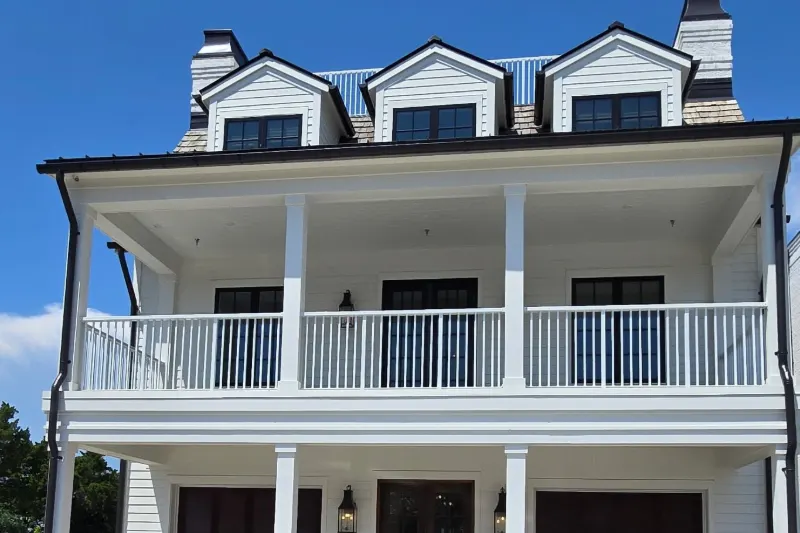 Waterfront custom home in Beaufort, NC with dormers and a cedar shake roof