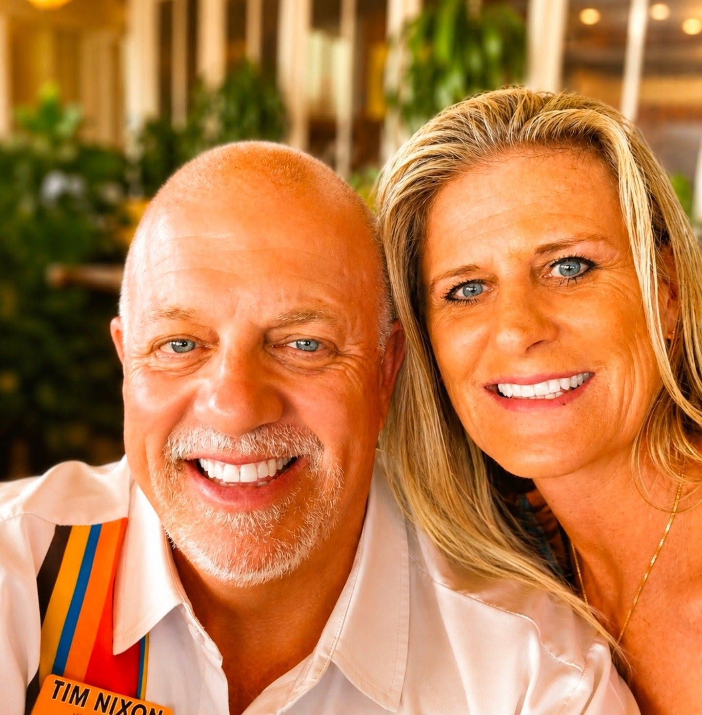 Close-up of Amy and Tim Nixon smiling together