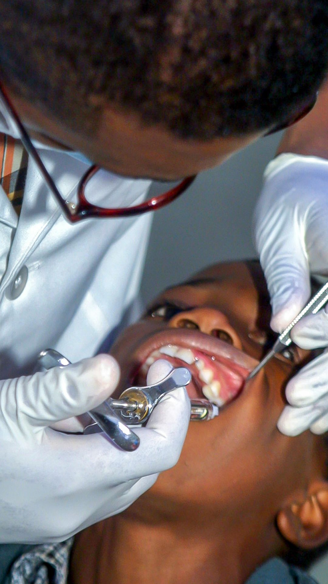 kid getting his teeth clean with dental insurance