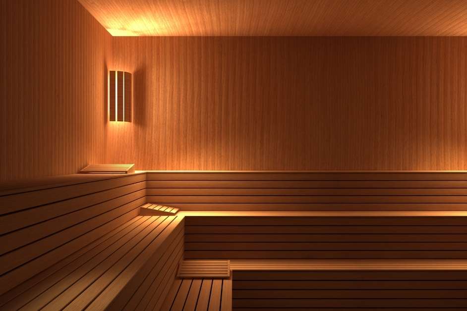 Custom indoor sauna with wood walls and benches