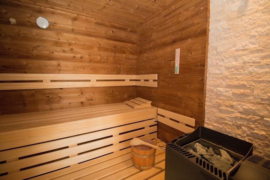 Custom wood sauna with multi-level bench seating