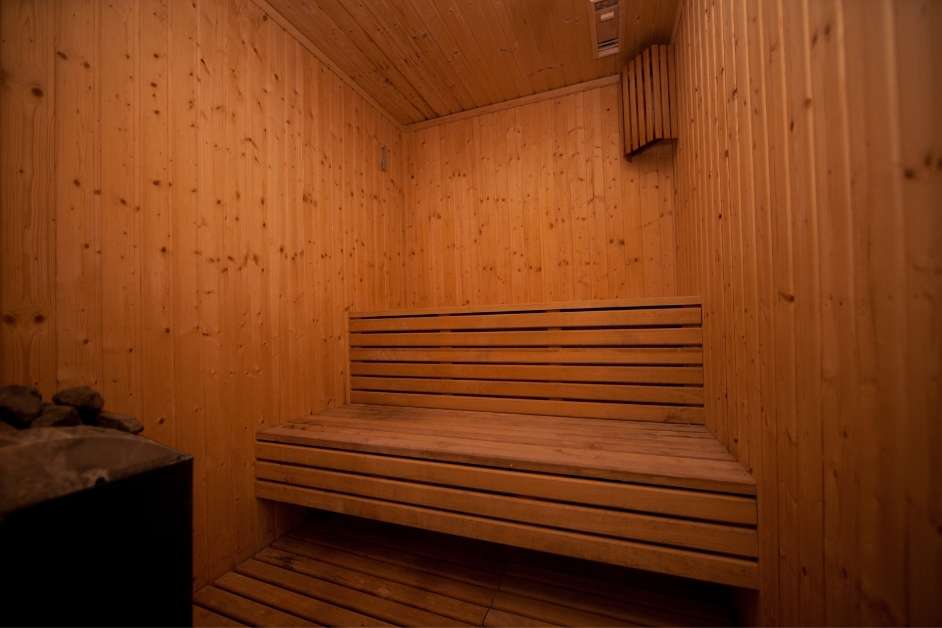Indoor sauna with custom wood walls and seating