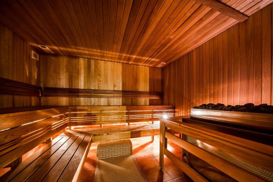 Commercial sauna interior with multiple bench levels