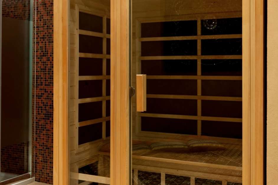 Infrared sauna with illuminated heat panels