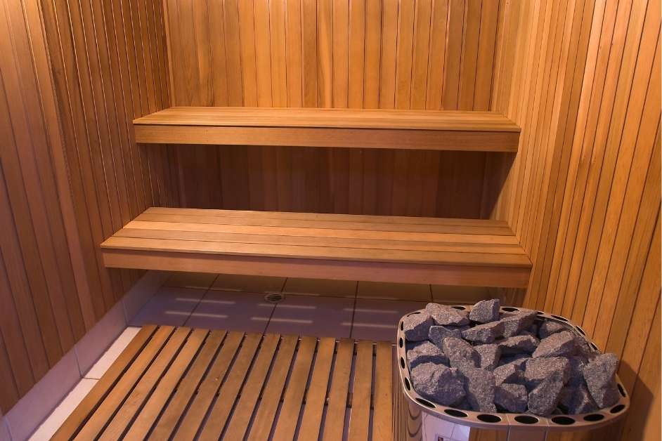 Custom indoor wood sauna with multi-level bench seating