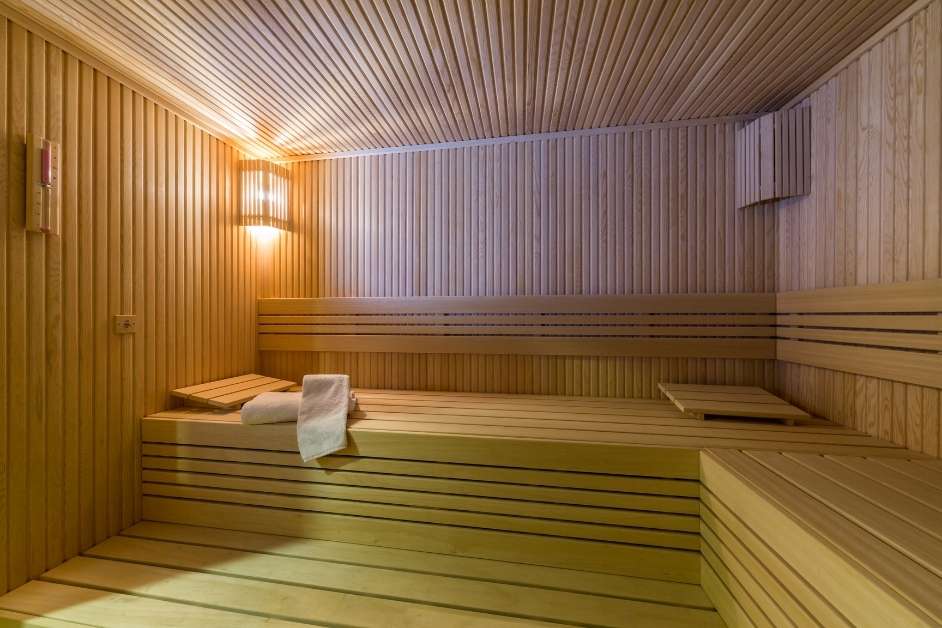 Custom wood sauna with tiered bench seating