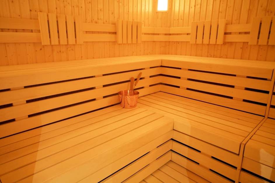 Indoor sauna with custom wood seating