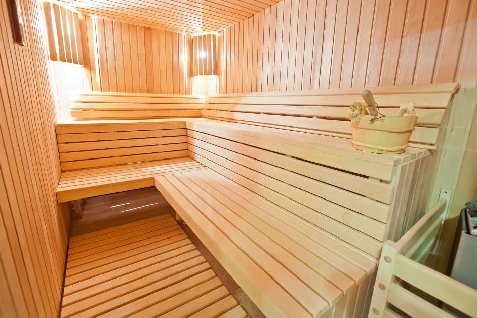 Wood interior and seating in a custom indoor sauna