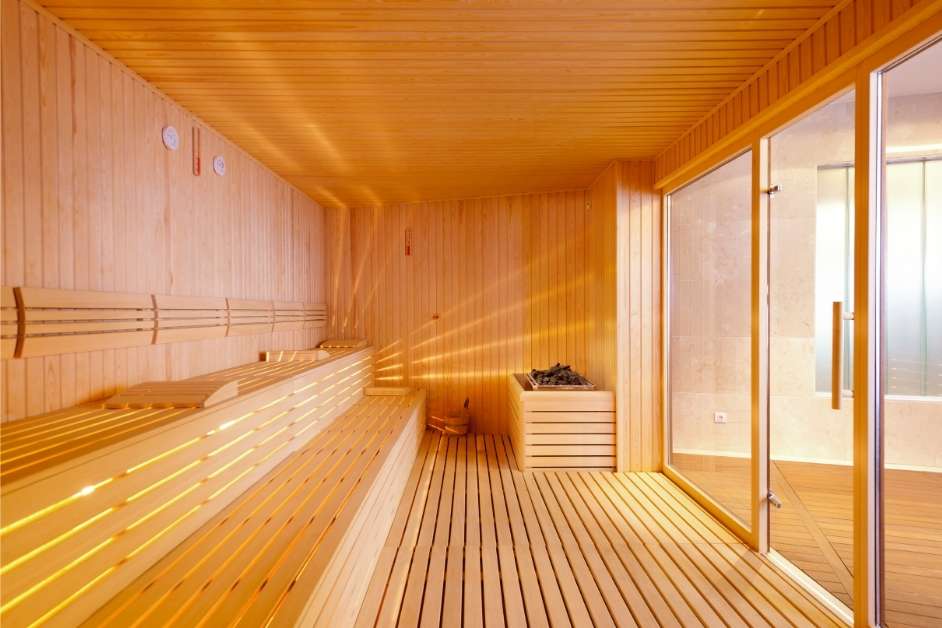 Indoor sauna room with custom wood interior