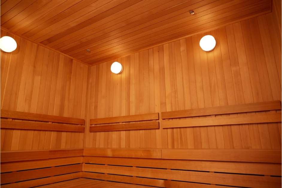 Custom wood sauna interior with tiered benches