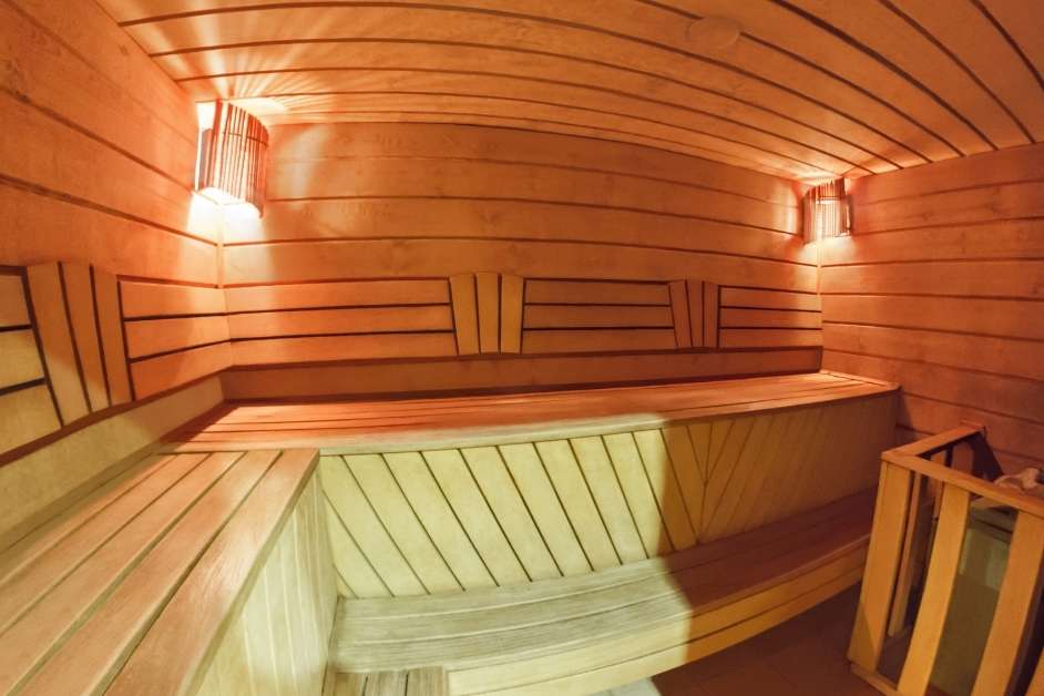 Custom wood sauna interior with upper and lower benches